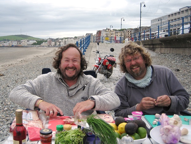 The Hairy Bikers tuck into a meal on Douglas beach (Department of Tourism and Leisure, Isle of Man Government)